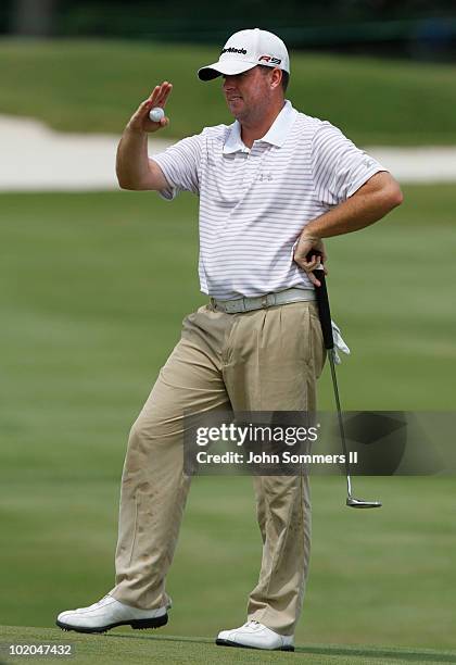 Robert Garrigus of the United States reacts after missing a birdie putt on the 12th hole during the final round of the St. Jude Classic at TPC...