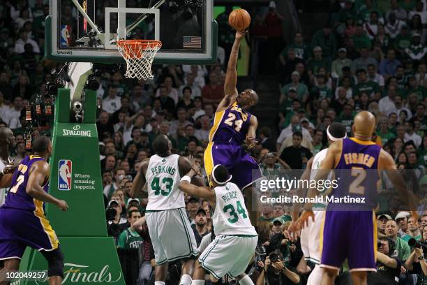 Kobe Bryant of the Los Angeles Lakers drives for a shot attempt against Kendrick Perkins and Paul Pierce of the Boston Celtics during Game Five of...