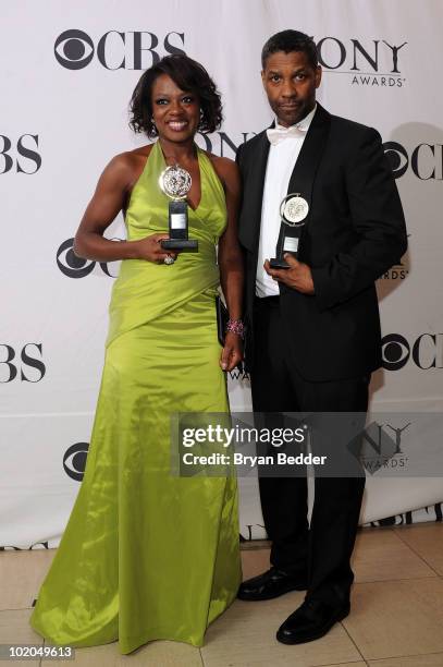 Actors Viola Davis and Denzel Washington pose with their awards at the 64th Annual Tony Awards at The Sports Club/LA on June 13, 2010 in New York...