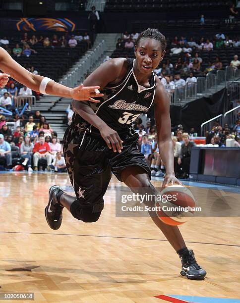 Sophia Young of the San Antonio Silver Stars drives against the Atlanta Dream at Philips Arena on June 13, 2010 in Atlanta, Georgia. NOTE TO USER:...