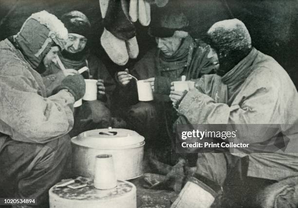 Members of the Polar Party Having A Meal in Camp ', circa 1911, . Petty Officer Edgar Evans , Lieutenant Henry 'Birdie' Bowers , Dr Edward Wilson and...