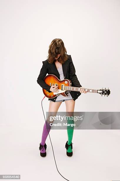 young girl playing an electric guitar - girl socks - fotografias e filmes do acervo