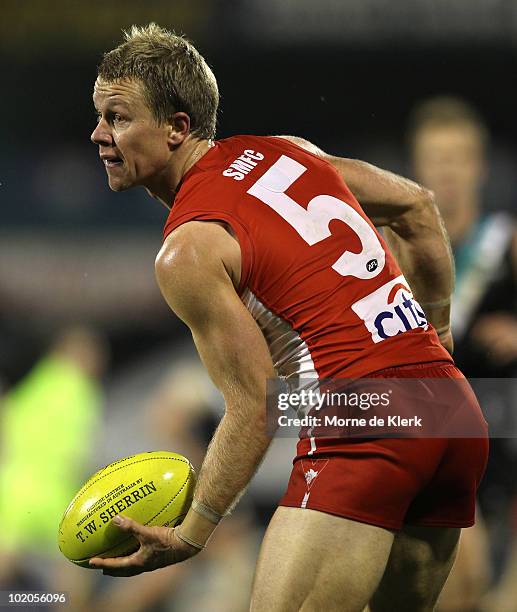 Ryan O'Keefe of the Swans passes the ball during the round 12 AFL match between the Port Adelaide Power and the Sydney Swans at AAMI Stadium on June...
