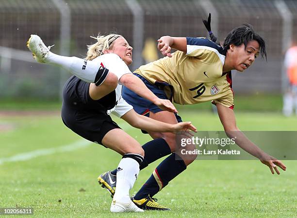 Svenja Huth of Germany challenges Sydney Leroux of USA during the DFB women's U20 match between Germany and USA at the Ludwig-Jahn-Stadion on June 13...