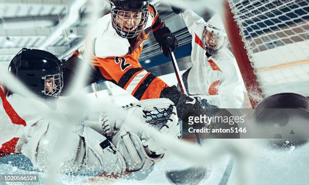 the ice hockey sport female players in action, motion, movement. sport comptetition concpet, girls on training or game at arena - ice hockey stock pictures, royalty-free photos & images