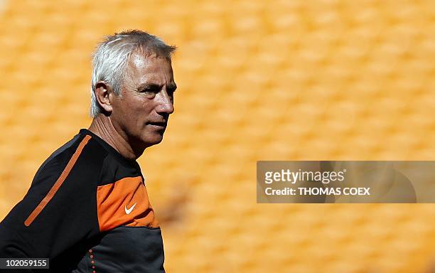 Netherlands' coach Bert Van Marwijk observes the Netherlands' national football team players during a training session at the Soccer City Stadium in...