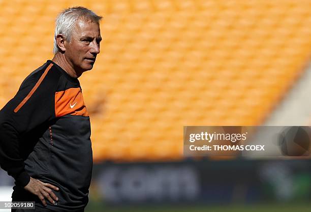 Netherlands' coach Bert Van Marwijk observes the Netherlands' national football team players during a training session at the Soccer City Stadium in...