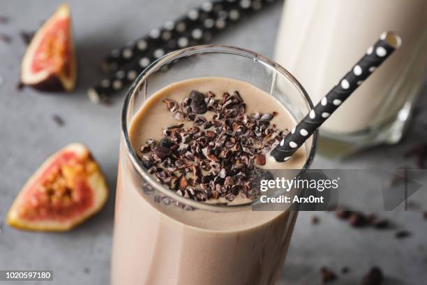 chocolate milkshake closeup view - almonds and chocolate stock-fotos und bilder