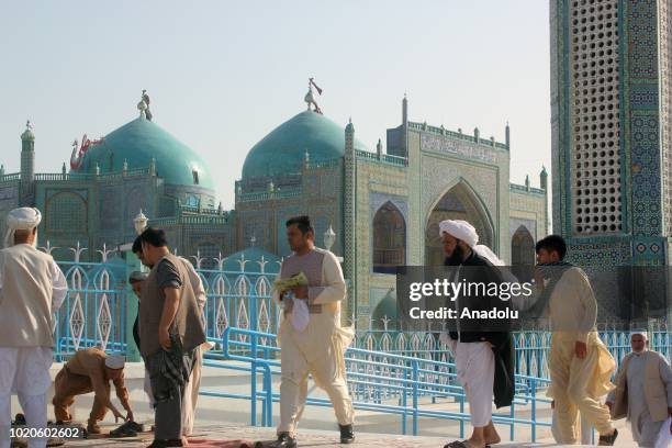 Afghan muslims gather to perform the Eid Al-Adha prayer at Rawza-i-Sharif mosque in Mazar-i-Sharif, Afghanistan on August 21, 2018. Muslims worldwide...