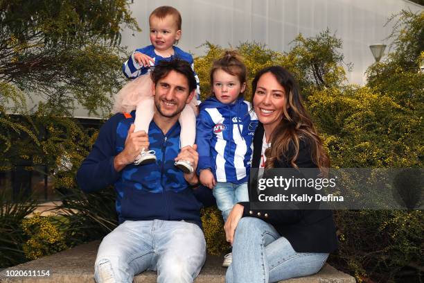Jarrad Waite of the North Melbourne Kangaroos poses for a portrait with his family during a press conference at Arden Street Ground on August 21,...