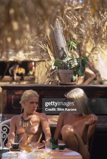 Two topless ladies in Saint-Tropez, on the French Riviera, August 1971.