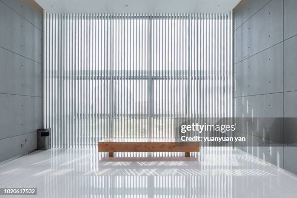 bench in the building - background concrete indoor stock pictures, royalty-free photos & images