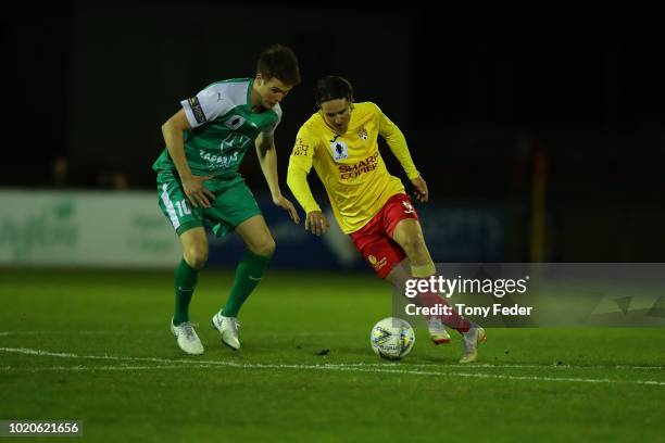 Christopher Lucas of Broadmeadow contests the ball with Tyson Holmes of Bentleigh during the FFA Cup round of 16 match between Broadmeadow Magic and...