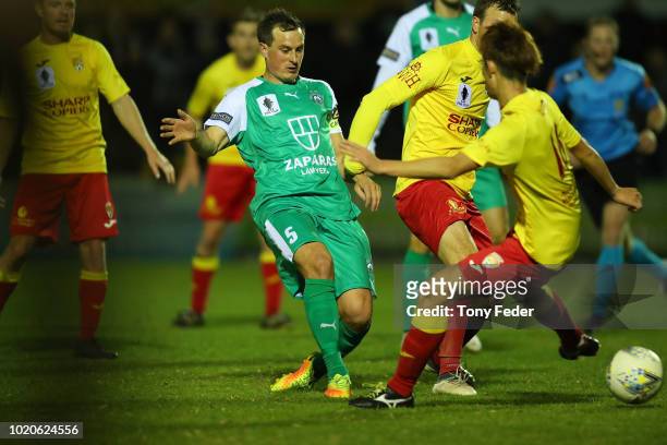 Jack Webster of Bentleigh contests the ball with Joshua Meaker of Broadmeadow during the FFA Cup round of 16 match between Broadmeadow Magic and...
