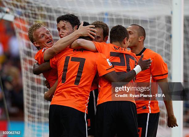 Eljero Elia of the Netherlands celebrates with team mates after his shot hit the post and Dirk Kuyt scores from the rebound during the 2010 FIFA...