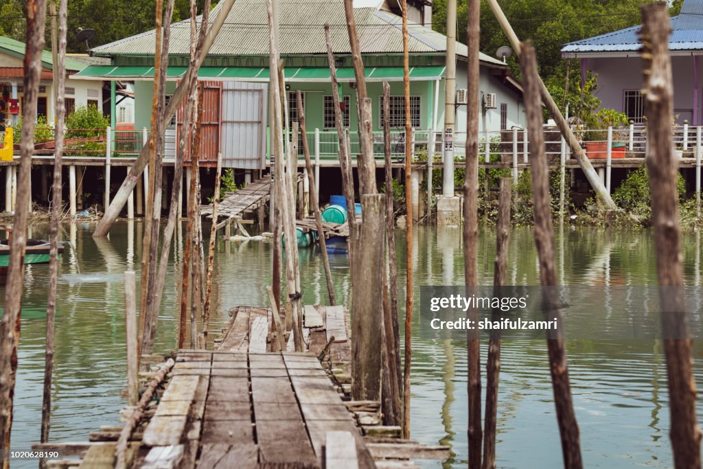 A view of a fishermen's village on stilts besides the sea in Pulau Ketam (Crab Island). This island is famous for sea food products and restaurants.