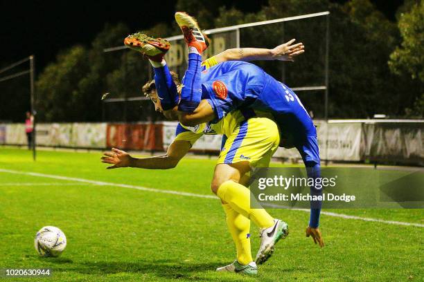 Yitay TOWNS of Avondale of Avondale competes for the ball over Joel STONE of Devonport during the FFA Cup round of 16 match between Avondale FC and...