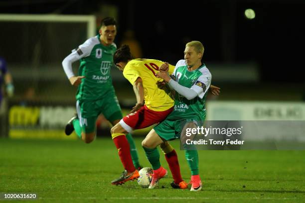 Cody Carroll of Broadmeadow contests the ball with Christopher Lucas of Bentleigh during the FFA Cup round of 16 match between Broadmeadow Magic and...