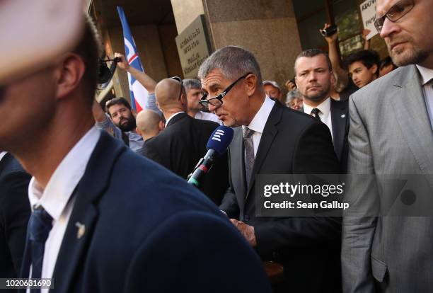 Czech Prime Minister Andrej Babis, facing irate protesters, attempts to speak at a ceremony outside the studios of Czech Radio during a ceremony to...