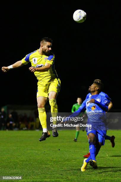 Guillermo LAZCANO of Devonport heads the ball over Elvis KAMSOBA of Avondale during the FFA Cup round of 16 match between Avondale FC and Devonport...