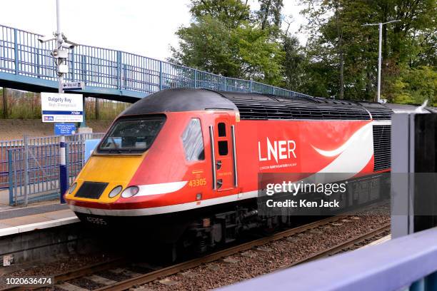 An east coast mainline express in the livery of London North Eastern Railway, the new operator following the early termination of the Virgin /...