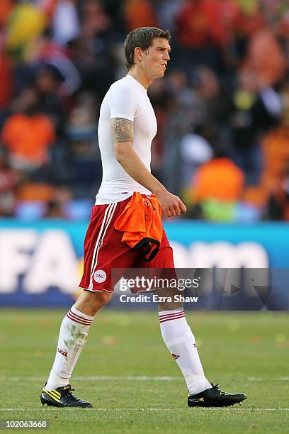 Daniel Agger of Denmark leaves the field dejected after the 2010 FIFA World Cup Group E match between Netherlands and Denmark at Soccer City Stadium...