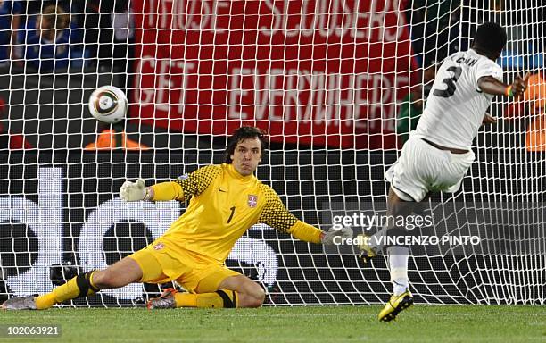 Ghana's striker Asamoah Gyan shoots to score the opening goal against Serbia during the Group D first round 2010 World Cup football match Serbia vs....