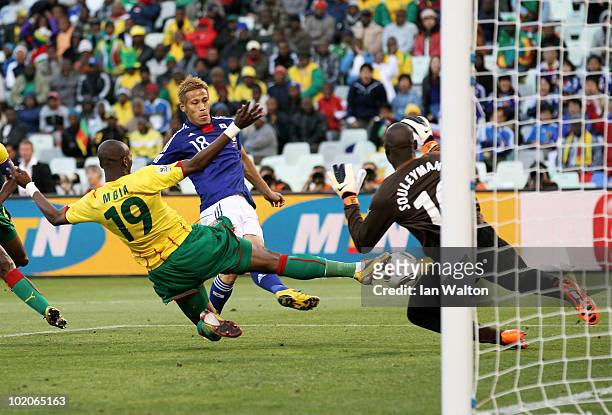 Keisuke Honda of Japan scores the first goal past Hamidou Souleymanou of Cameroon during the 2010 FIFA World Cup South Africa Group E match between...