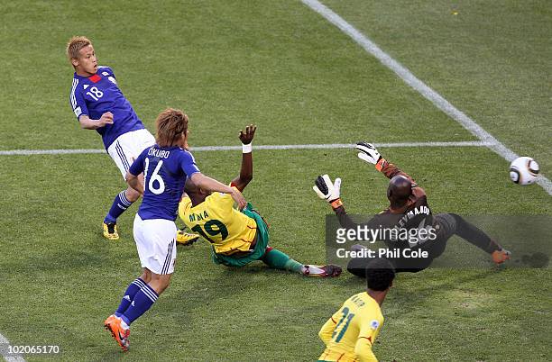 Keisuke Honda of Japan scores the first goal past Hamidou Souleymanou of Cameroon during the 2010 FIFA World Cup South Africa Group E match between...