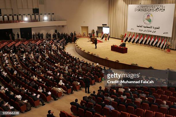 Iraqi lawmakers are seen taking the oath during the first session of the Iraqi Parliament on June 14, 2010 at the Green Zone in Baghdad, Iraq. The...