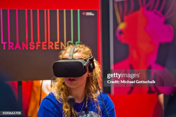 Visitors try video games at 2018 gamescom fair press day on August 21, 2018 in Cologne, Germany. Gamescom is Europe's biggest trade fair for the...