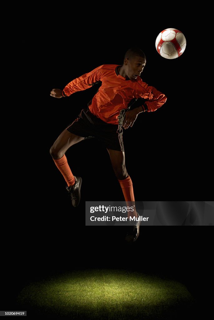 Footballer heading ball