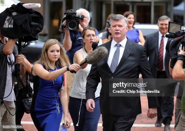 Kevin Downing, lead attorney for former Trump campaign chairman Paul Manafort, is pursued by reporters as he walks to the Albert V. Bryan U.S....