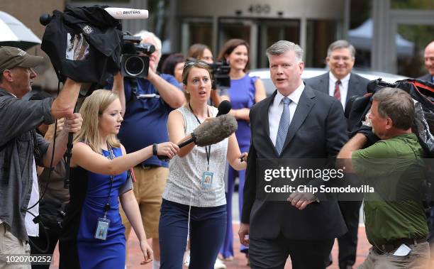 Kevin Downing, lead attorney for former Trump campaign chairman Paul Manafort, is pursued by reporters as he walks to the Albert V. Bryan U.S....