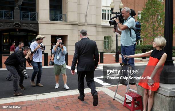 Kevin Downing, lead attorney for former Trump campaign chairman Paul Manafort, is pursued by photographers as he walks to the Albert V. Bryan U.S....