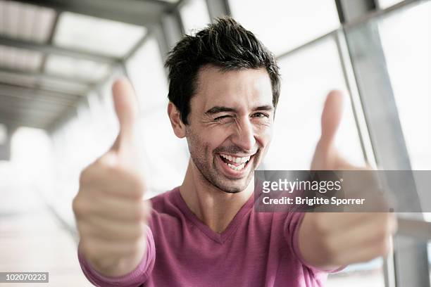 man giving two thumbs up - thumbs up stock-fotos und bilder