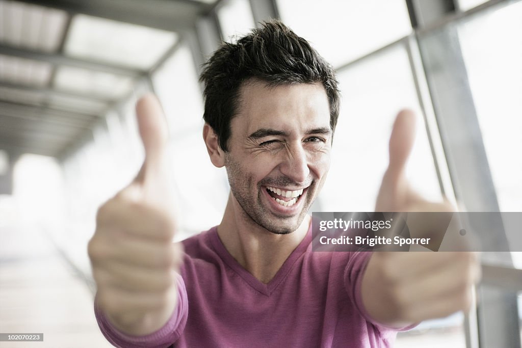 Man giving two thumbs up