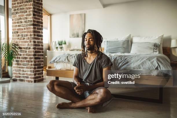 first thing in the morning for him is yoga - zen man stock pictures, royalty-free photos & images