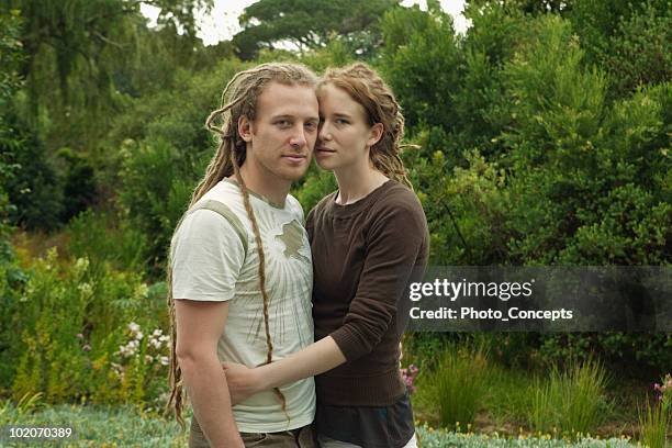 woman with arms around man - dreadlocks stock pictures, royalty-free photos & images