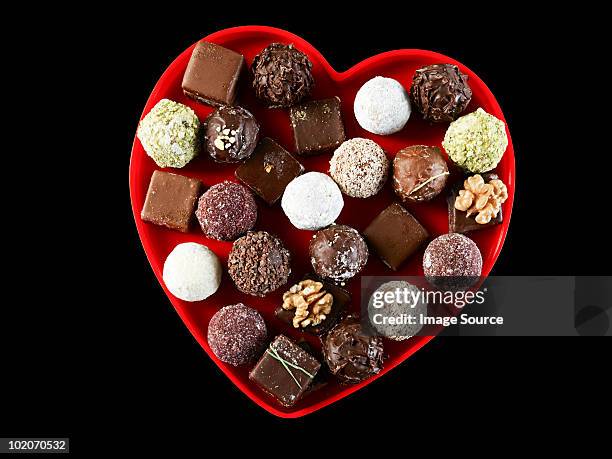 chocolates in heart shape - chocolate box stock-fotos und bilder