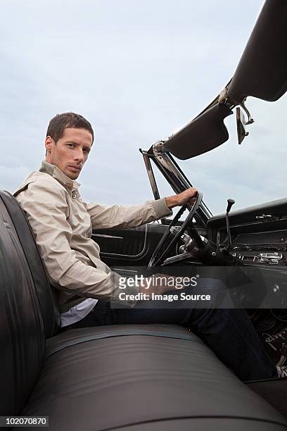 mid adult man in convertible car - passagerarsäte bildbanksfoton och bilder