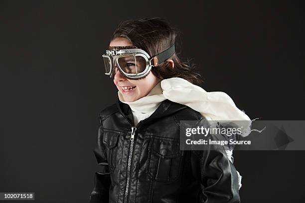 young boy wearing flying goggles, dressed as pilot - kid pilot stock pictures, royalty-free photos & images