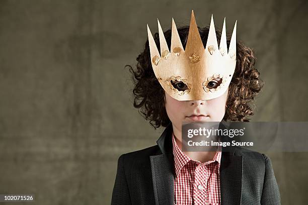 young boy wearing gold crown mask - gold jacket stock pictures, royalty-free photos & images