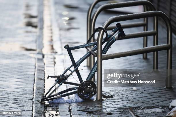 Frame locked up to bike stand that appears to have had parts stolen by thieves February 27, 2018 in Cardiff, United Kingdom.