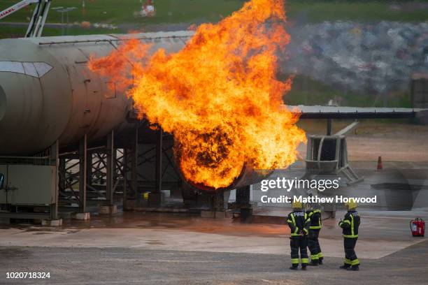 The fire service practice extinguishing fires from a training aircraft at Bristol Airport fire station on May 16, 2018 in Bristol, United Kingdom.