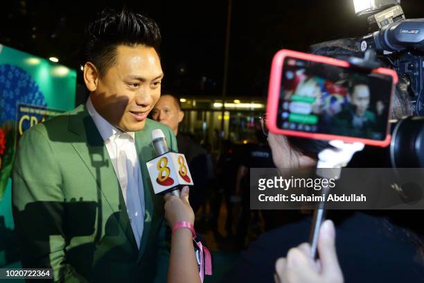 Director John M. Chu gives an interview during the Singapore premiere of 'Crazy Rich Asians' on August 21, 2018 in Singapore.