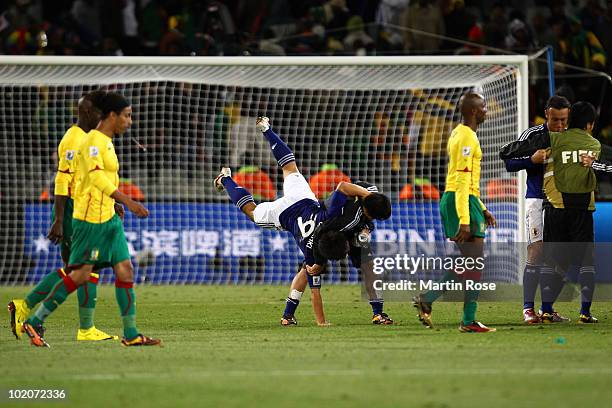 Shinji Okazaki of Japan celebrates with teammates after victory in the 2010 FIFA World Cup South Africa Group E match between Japan and Cameroon at...