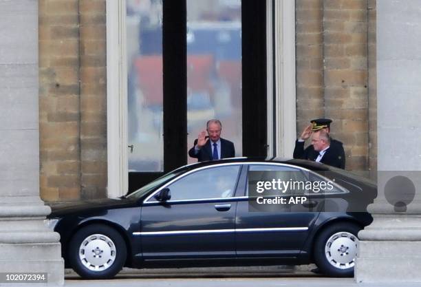 King Albert II waves goodbye to PS chairman Elio Di Rupo after his consultation with King Albert II, on June 14, 2010 at the Royal Castle in...