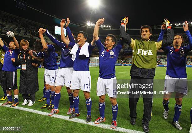 Players of Japan celebrate their victory in the 2010 FIFA World Cup South Africa Group E match between Japan and Cameroon at the Free State Stadium...