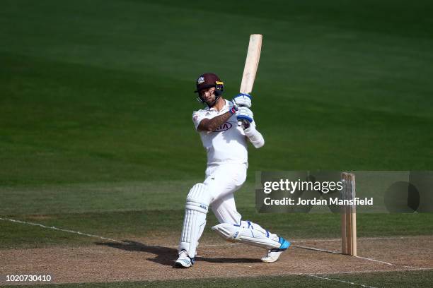 Jade Dernbach of Surrey hits out during day three of the Specsavers County Championship Division One match between Surrey and Lancashire at The Kia...